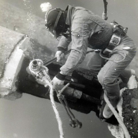Divers working underwater in jeans and tennis shoes. John Galletti photo. History of the Offshore Oil and Gas Industry in Southern Louisiana Volume VI: A Collection of Photographs.